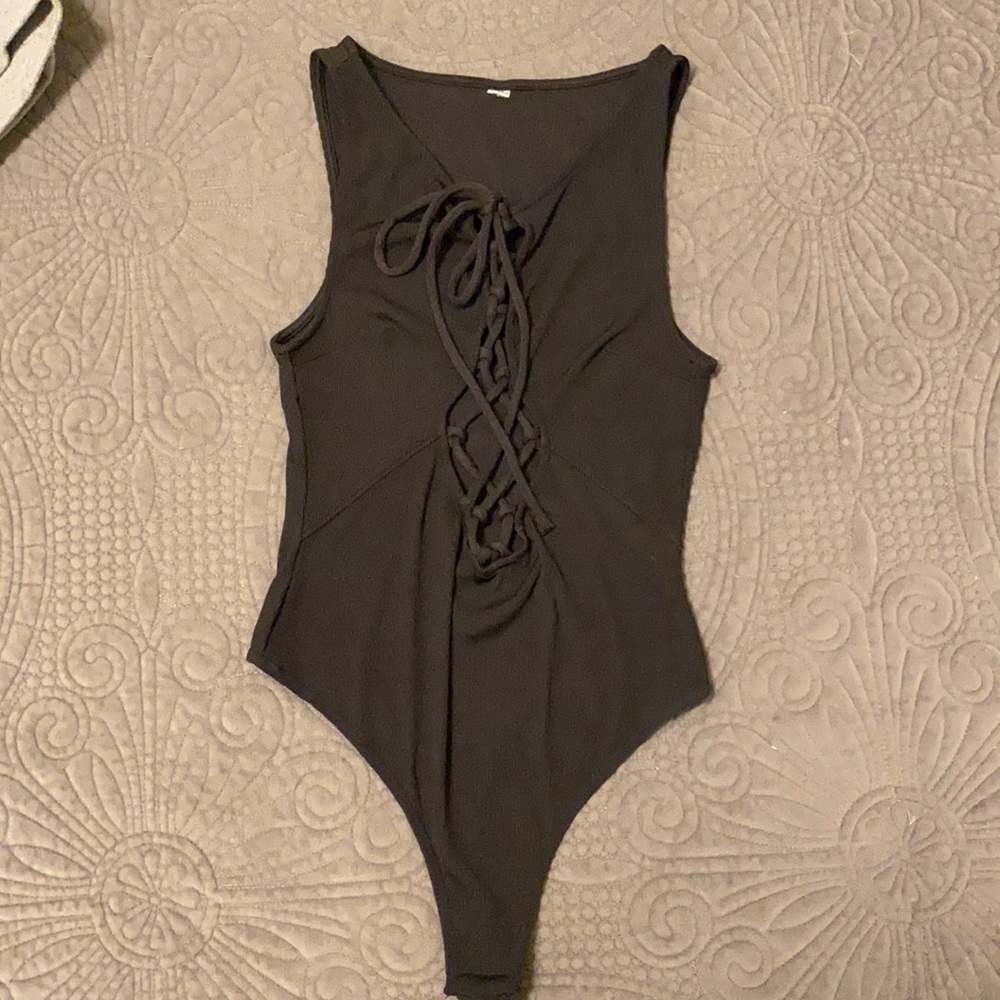 New- never worn thong body suits, lace up front